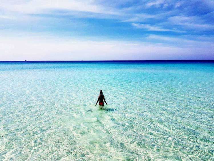 A Woman in Water on Long Beach - Koh Rong Island in Cambodia