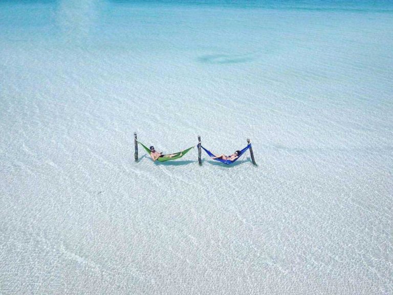 2 People Lying in Hammocks Over Water on Saracen Bay Koh Rong Samloem