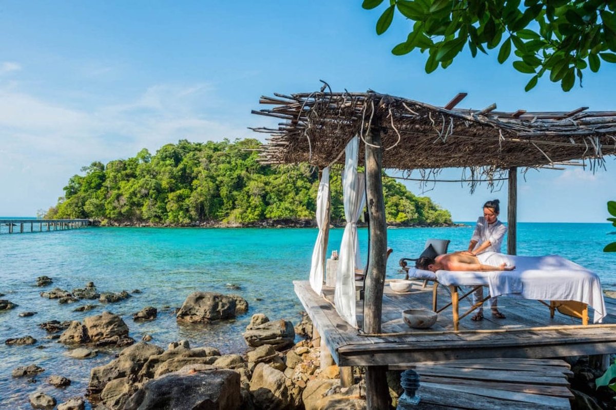 A woman having a massage overlooking the ocean in Cambodia
